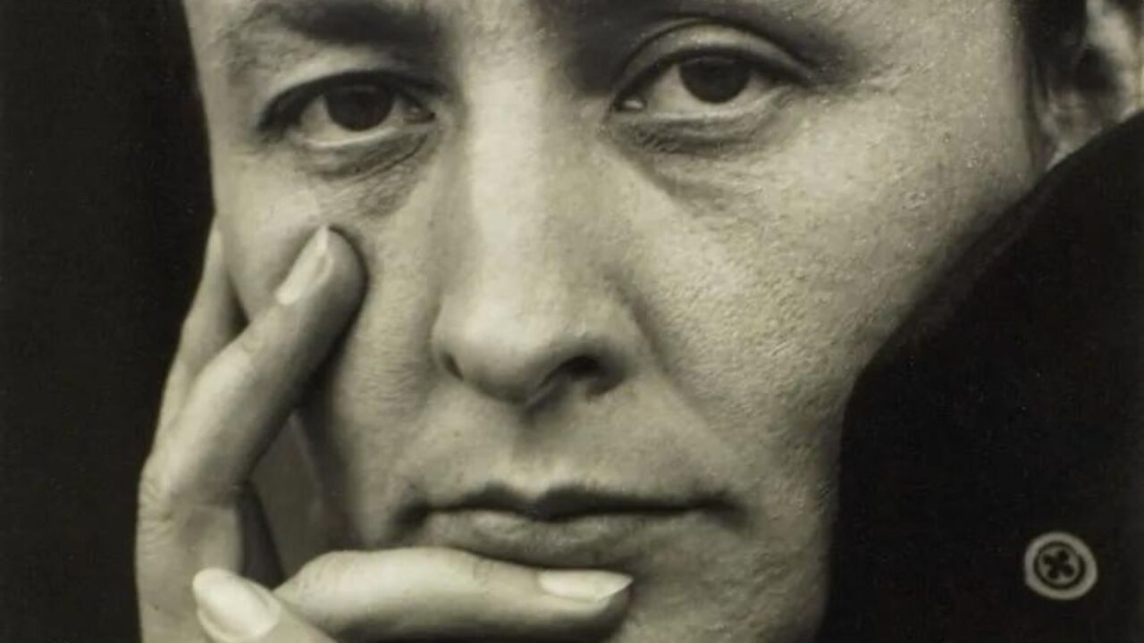Close-up sepia photograph of Georgia O’Keeffe.