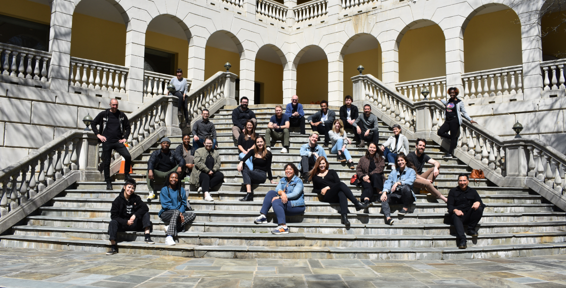 Threespot employees sitting on steps at the company retreat