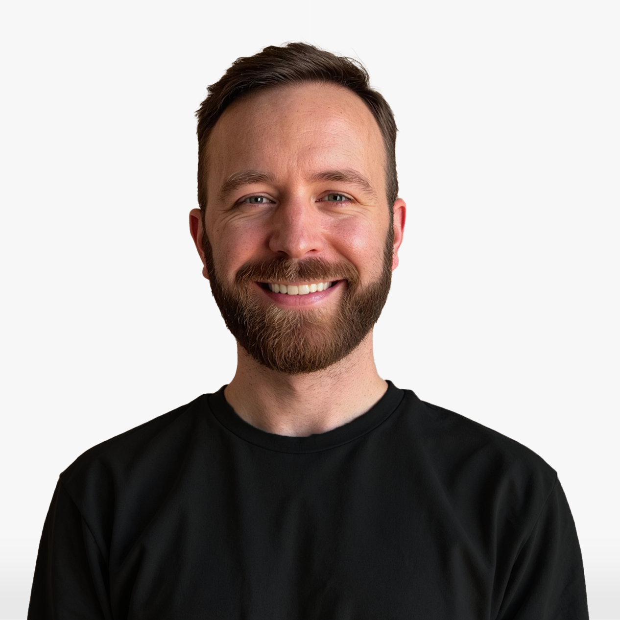 Nathan Fields, a white male in his thirties with brown hair and a full brown beard wearing a darker shirt and smiling.